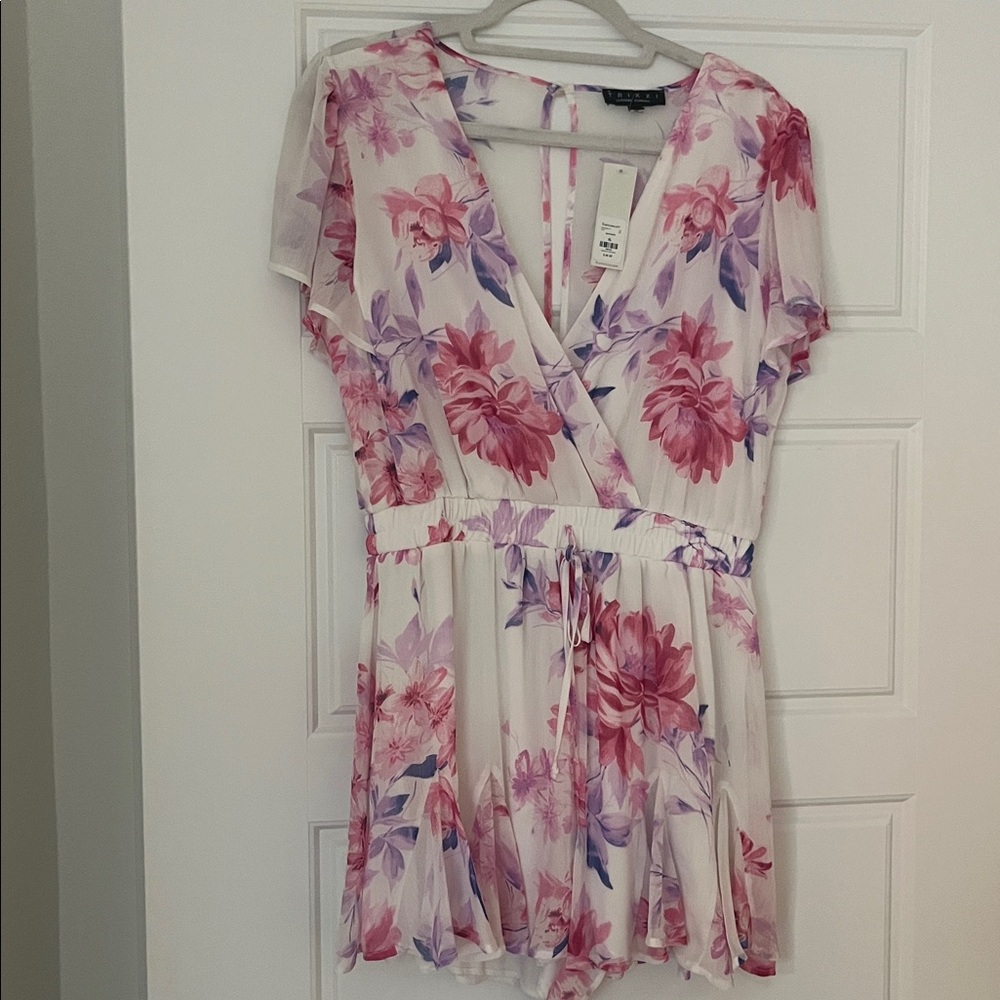 Francesca's Soft White Romper with Pink and Purple Accents